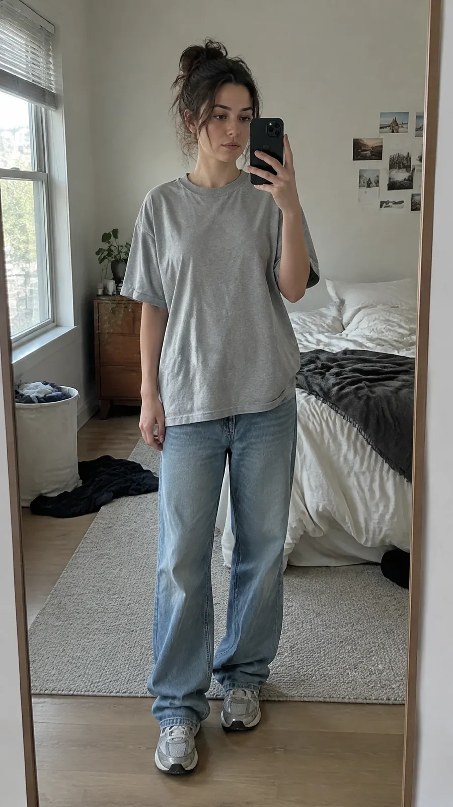 A plain basic outfit with unstyled oversized t-shirt and wrinkled jeans showing an unfinished everyday look